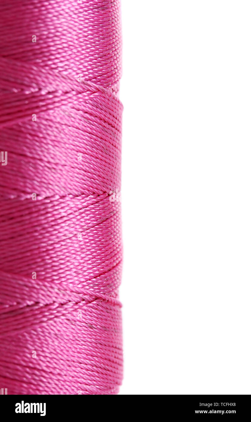 Pink Thread Bobbin pink bobbin thread isolated on white Stock Photo - Alamy