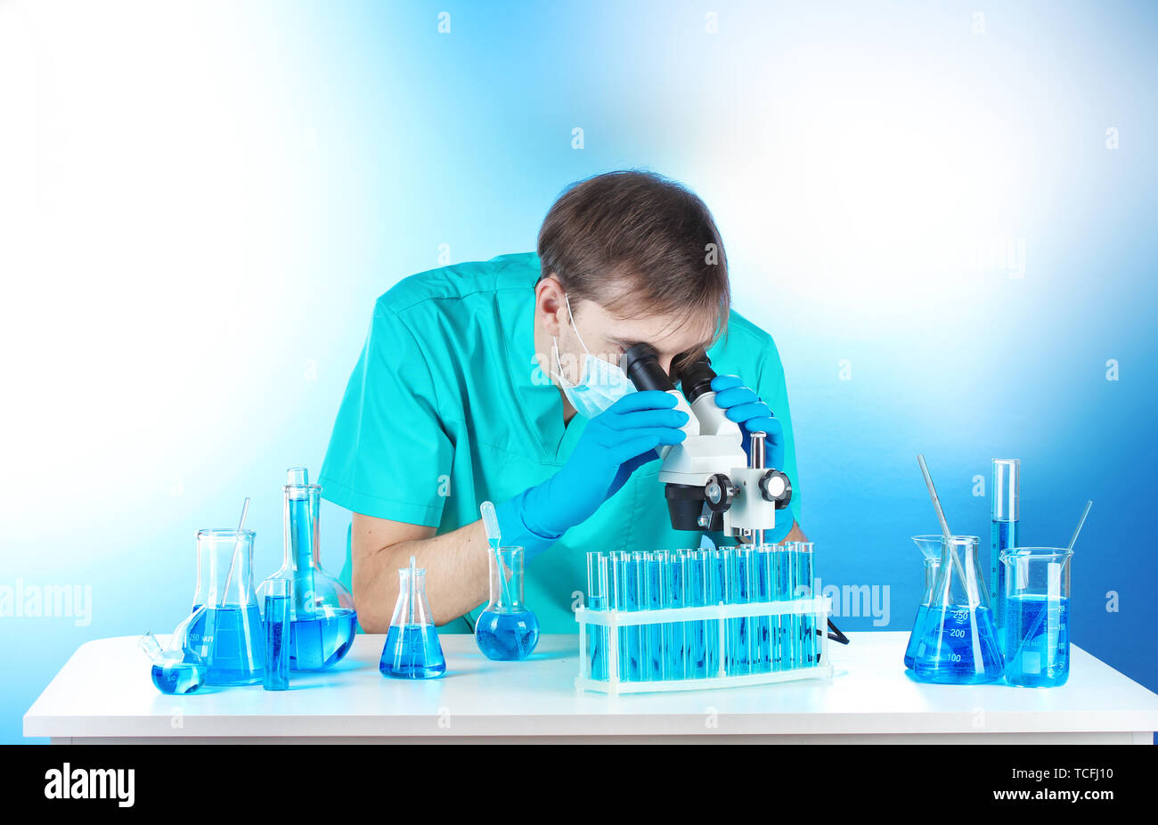 scientist in the lab working with microscope Stock Photo - Alamy