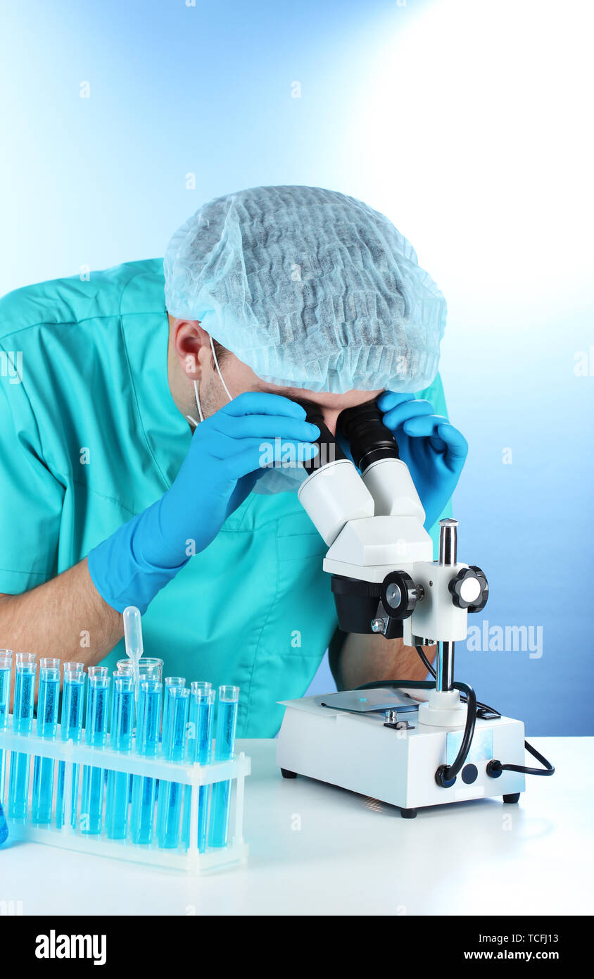 scientist in the lab working with microscope Stock Photo - Alamy