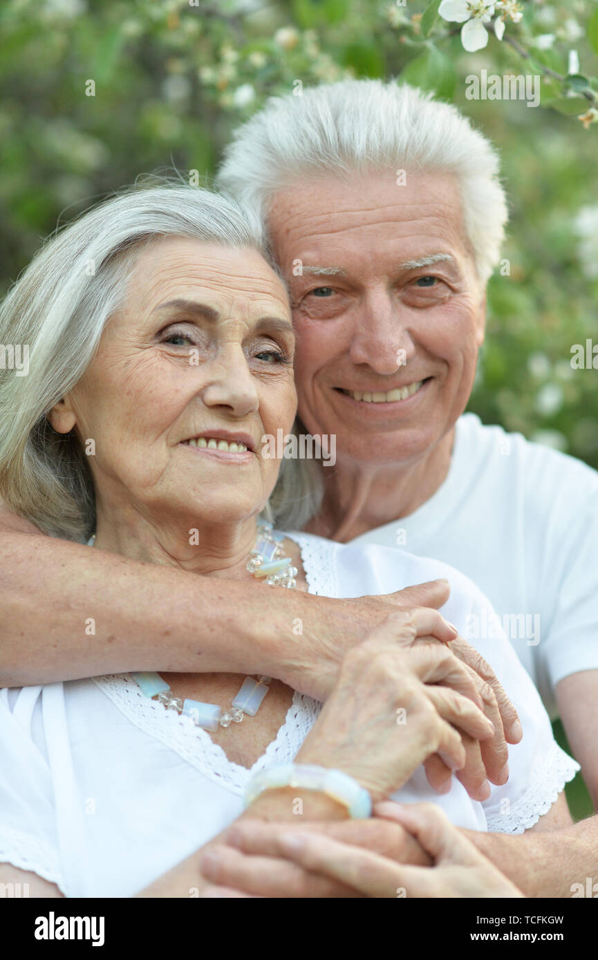 Portrait of beautiful senior couple posing in the park Stock Photo - Alamy