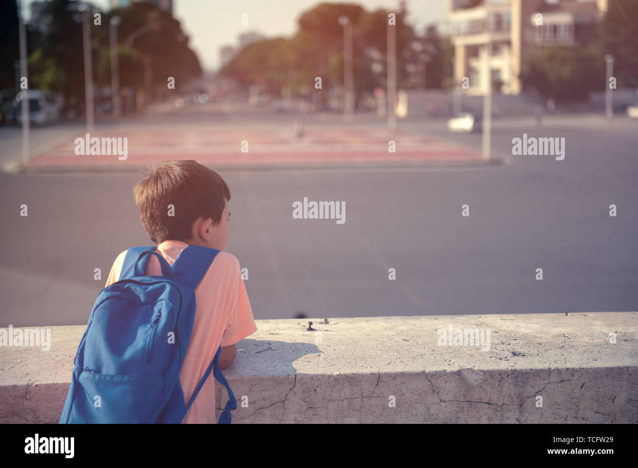 kid carrying backpack