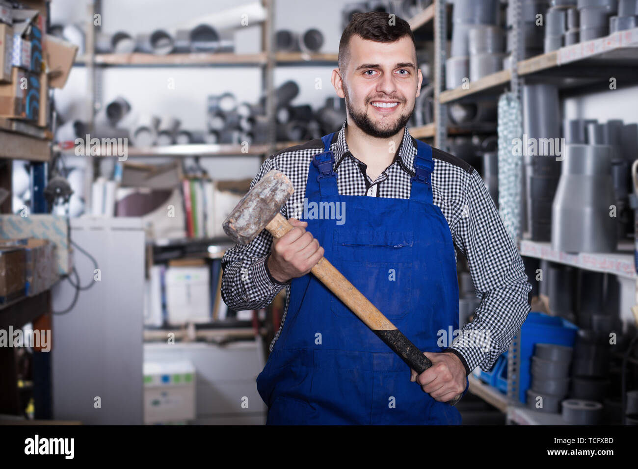 Worker male showing his constructing instruments at workshop Stock ...