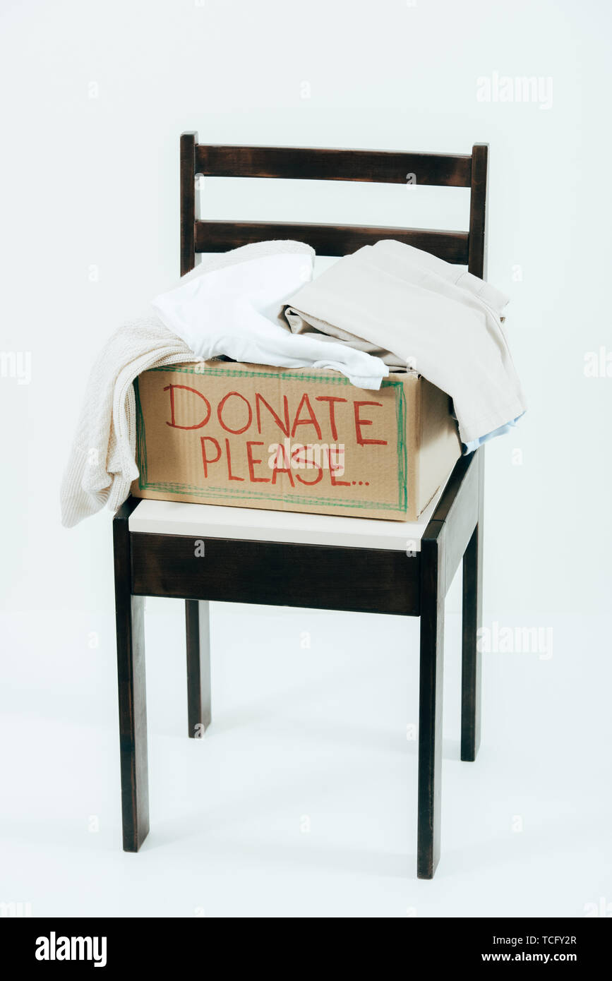 Premium Photo  Empty donate box on chair against wall