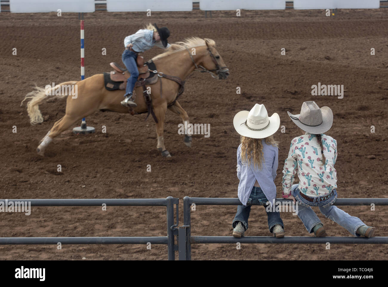 Heber City, Utah, USA. 7th June, 2019. Little girls sit on a fence to