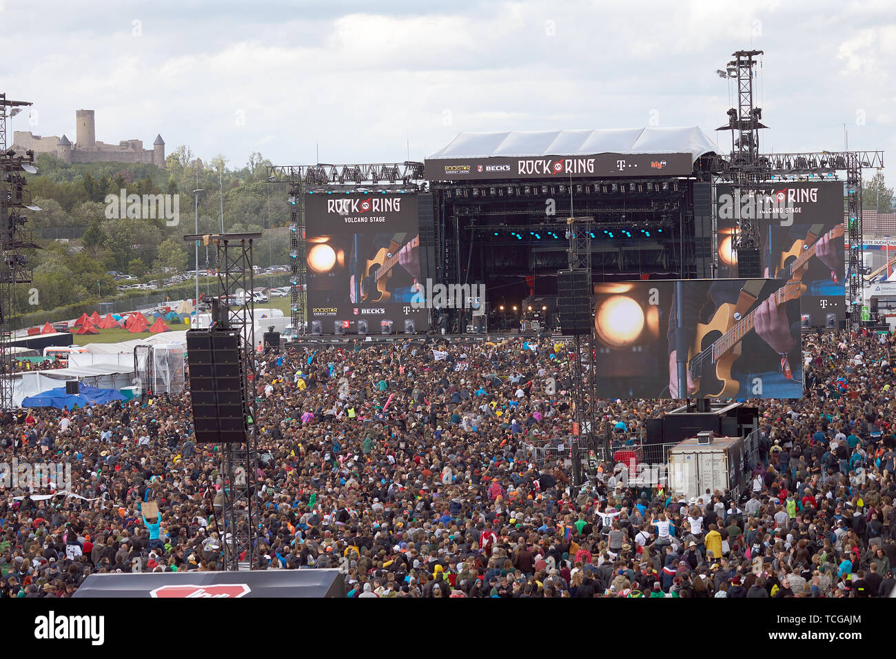 Nürburg, Germany, 08th June, 2019. Rock fans crowd during the performance  of the band "Feine Sahne Fischfilet" in front of the main stage of the  open-air festival "Rock am Ring". On three