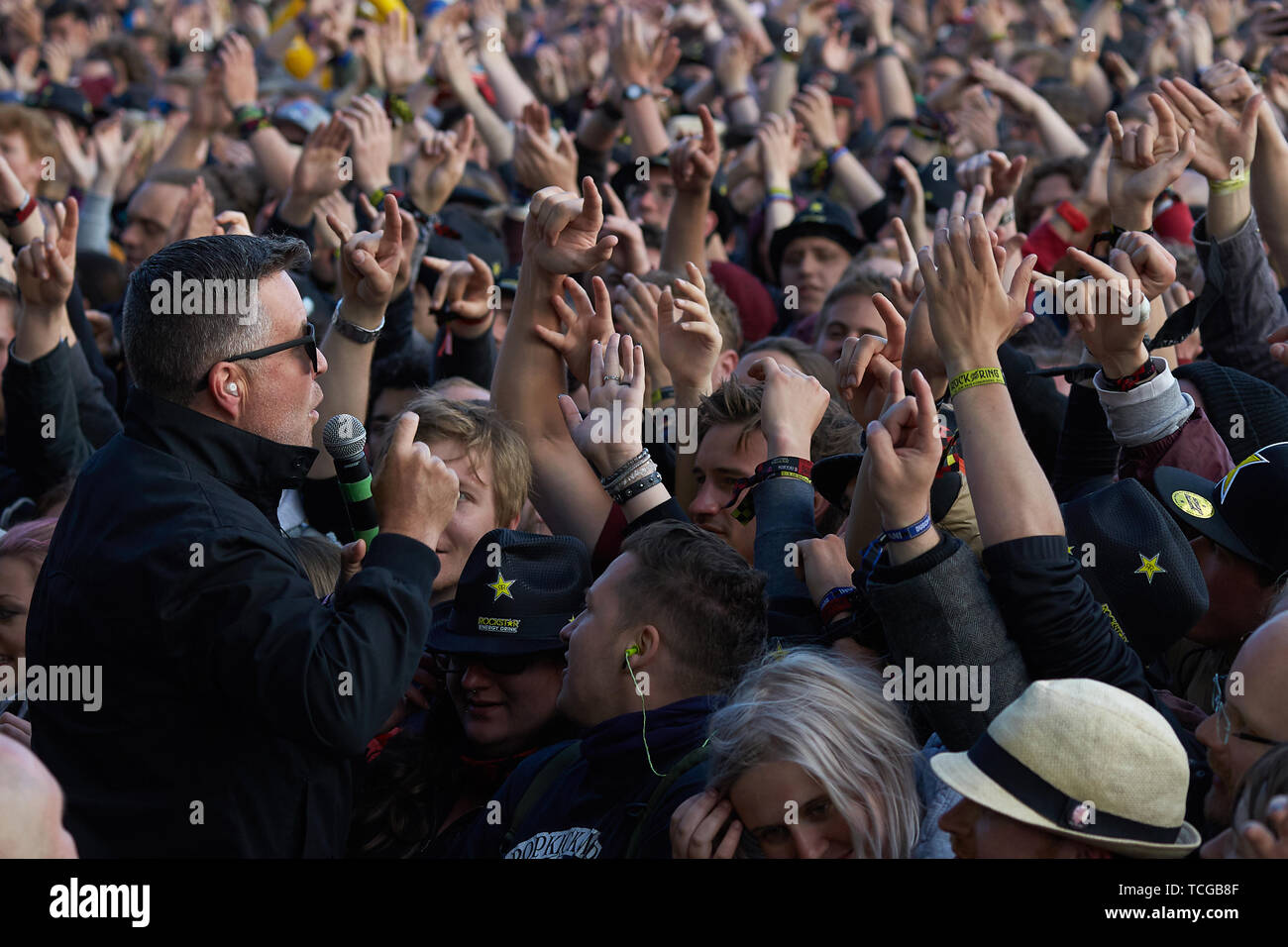 Nürburg, Germany, 08th June, 2019. Ken Casey (l), singer and bassist of the US-American folk-punk band 'Dropkick Murphys', sings with his fans in front of the main stage of the open-air festival 'Rock am Ring'. On three days about 75 bands will perform on three stages in front of more than 80 000 spectators. Photo: Thomas Frey/dpa Credit: dpa picture alliance/Alamy Live News Stock Photo