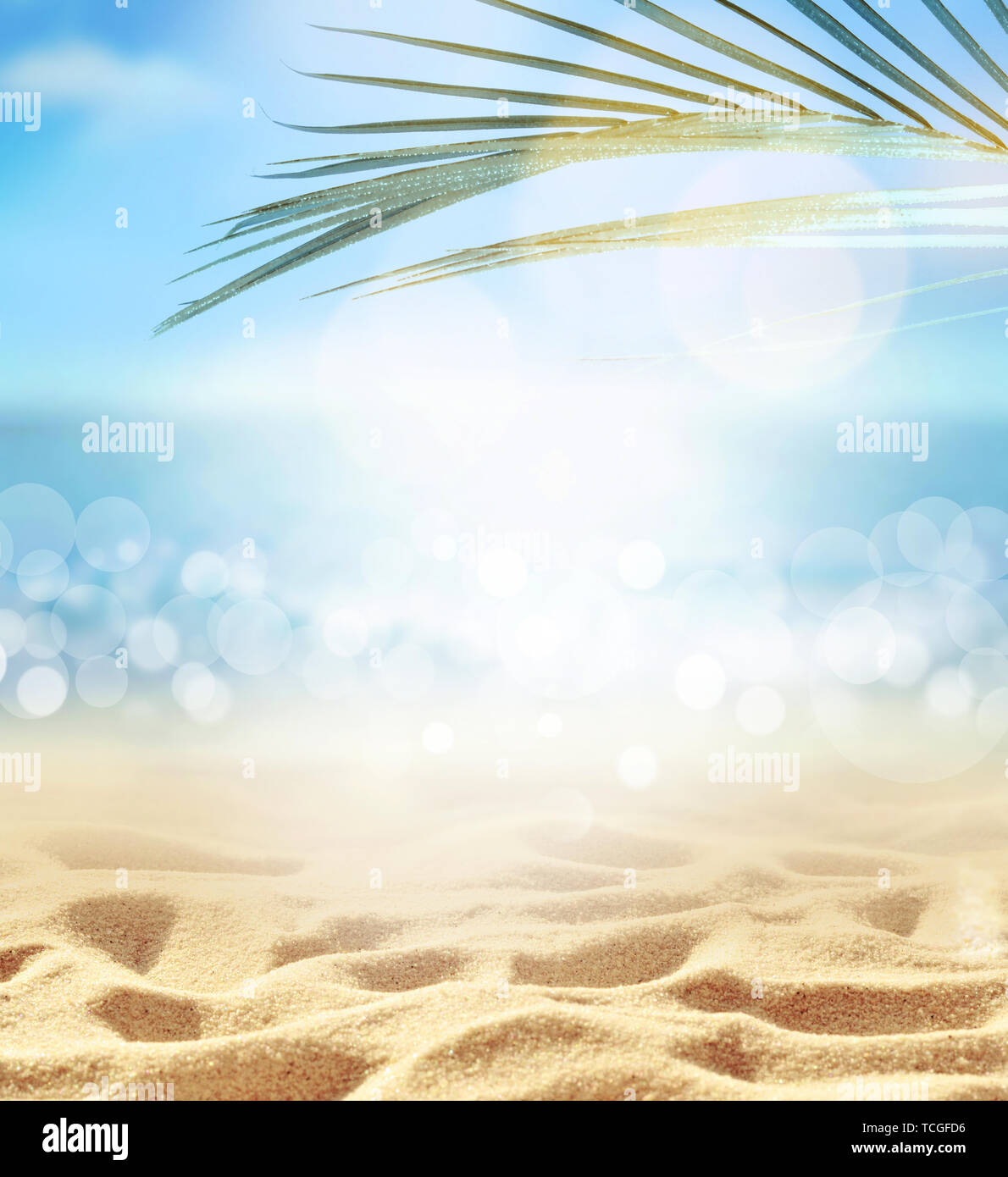 Summer beach background. Sand, palm leaf, sea and sky. Summer concept Stock Photo