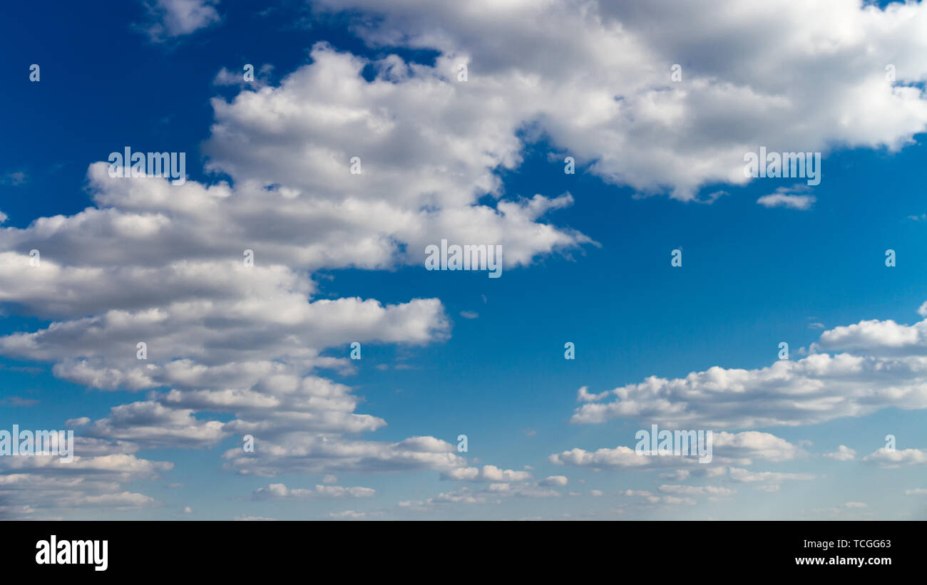 Blue sky with white clouds. Natural background image Stock Photo - Alamy