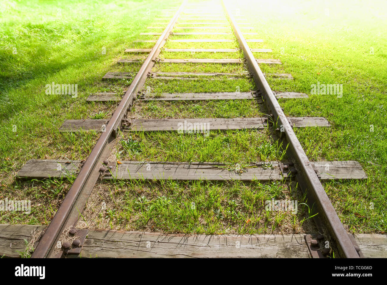 Railway track tending far away to infinity. Stock Photo