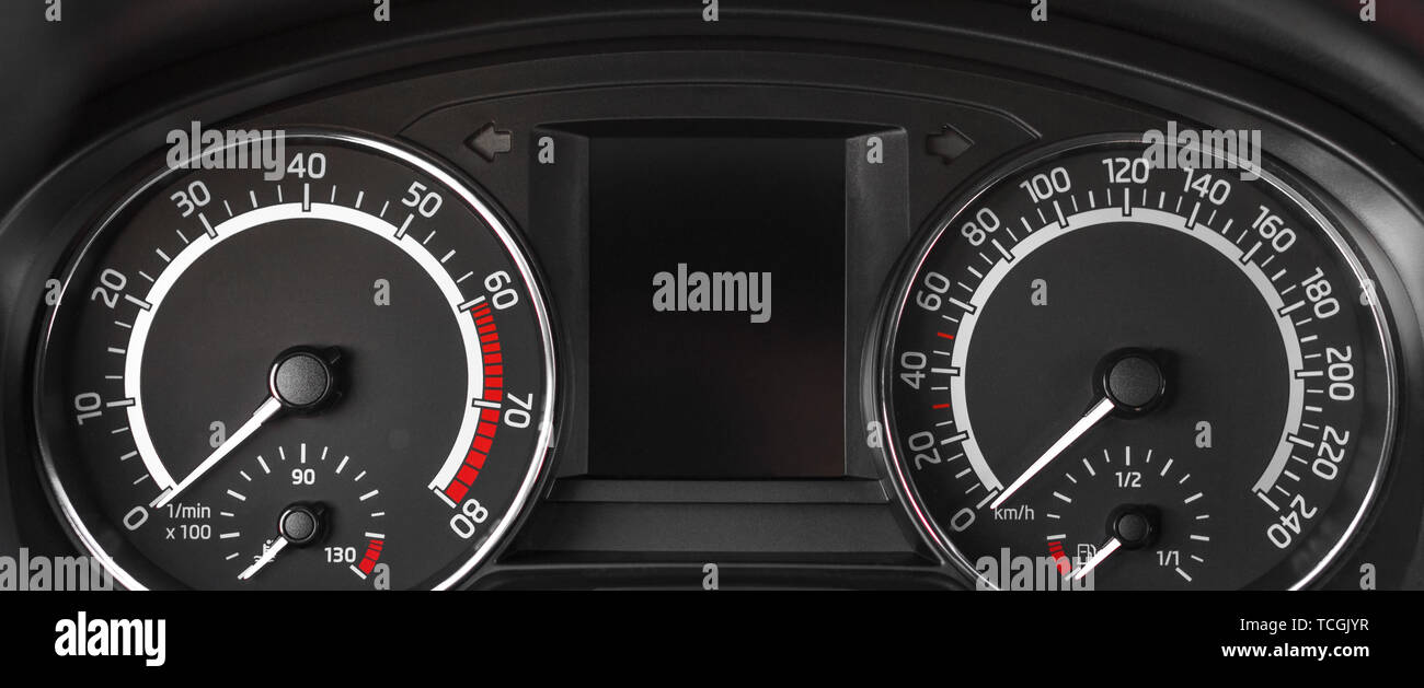 Close up to dashboard panel with tachometer and speedometer Stock Photo