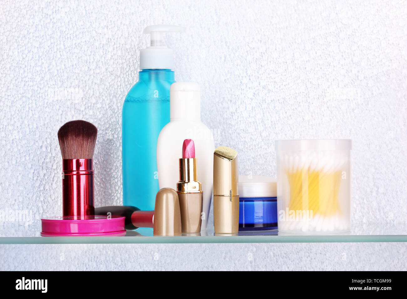 Shelf with cosmetics and toiletries in bathroom Stock Photo - Alamy