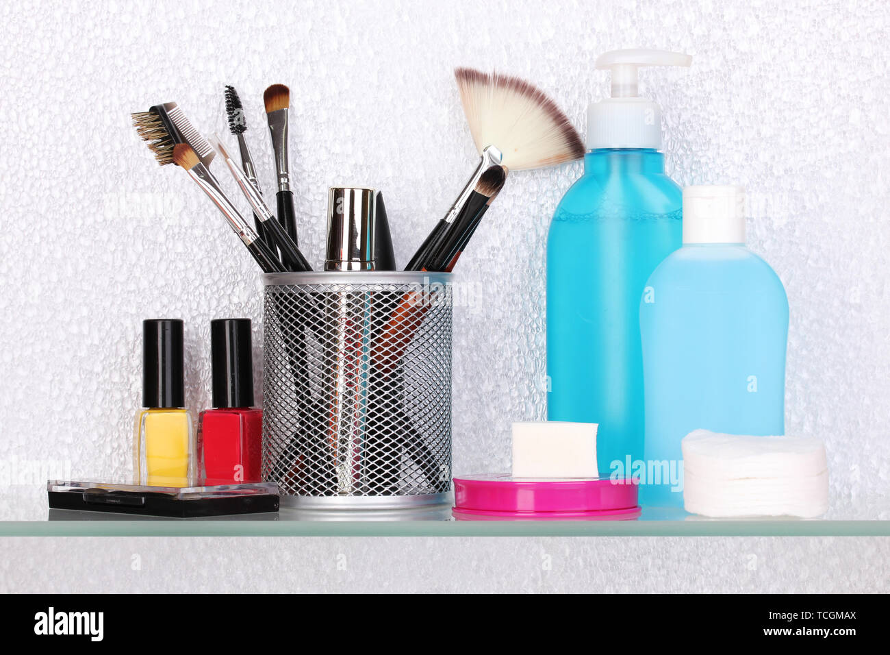 Shelf with cosmetics and toiletries in bathroom Stock Photo - Alamy