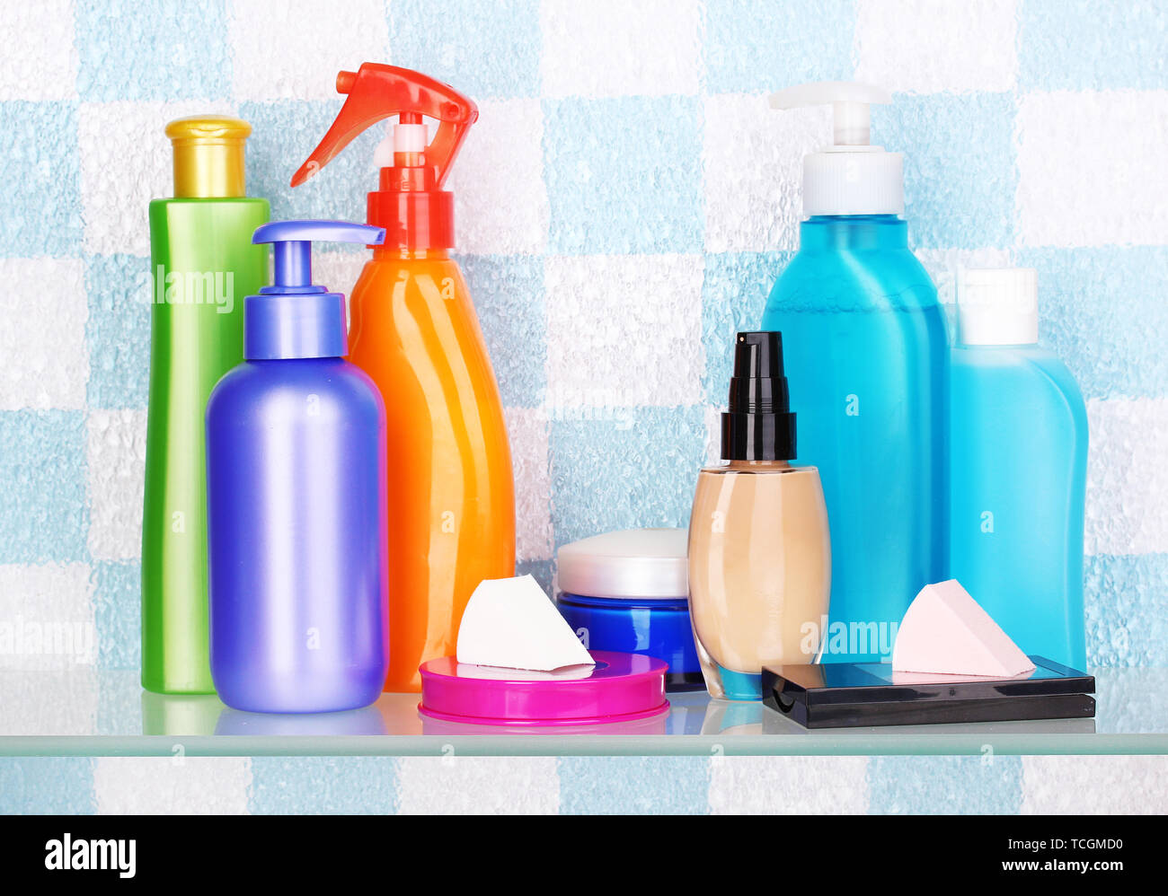 Shelf with cosmetics and toiletries in bathroom Stock Photo - Alamy
