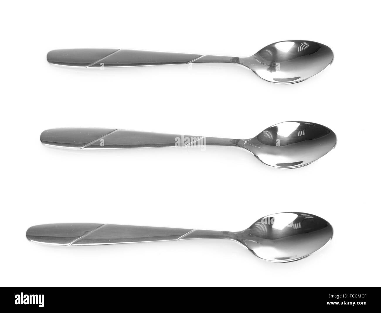 Three silver spoons isolated on white Stock Photo Alamy