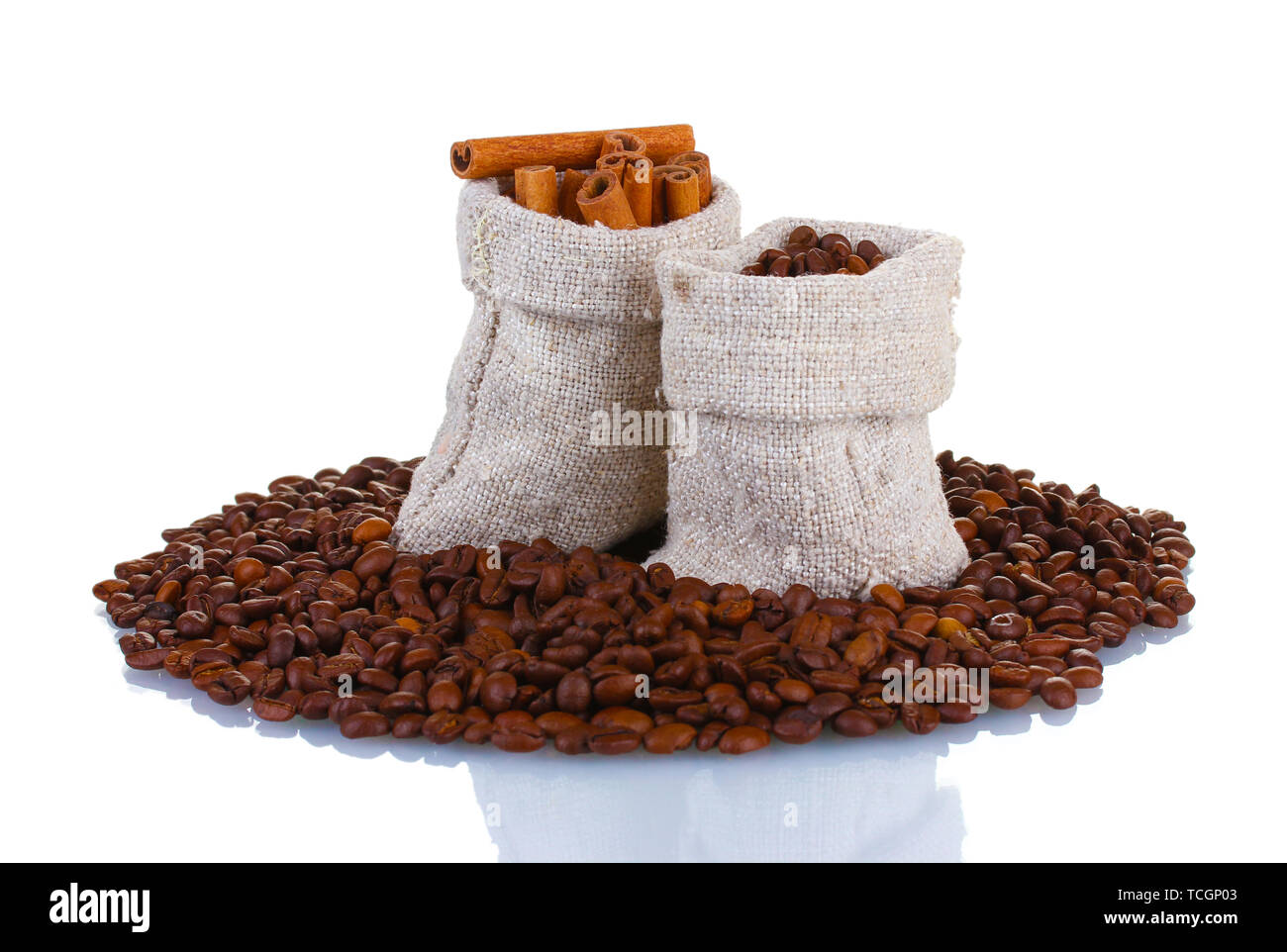 Coffee beans and cinnamon in canvas sacks isolated on white Stock Photo ...