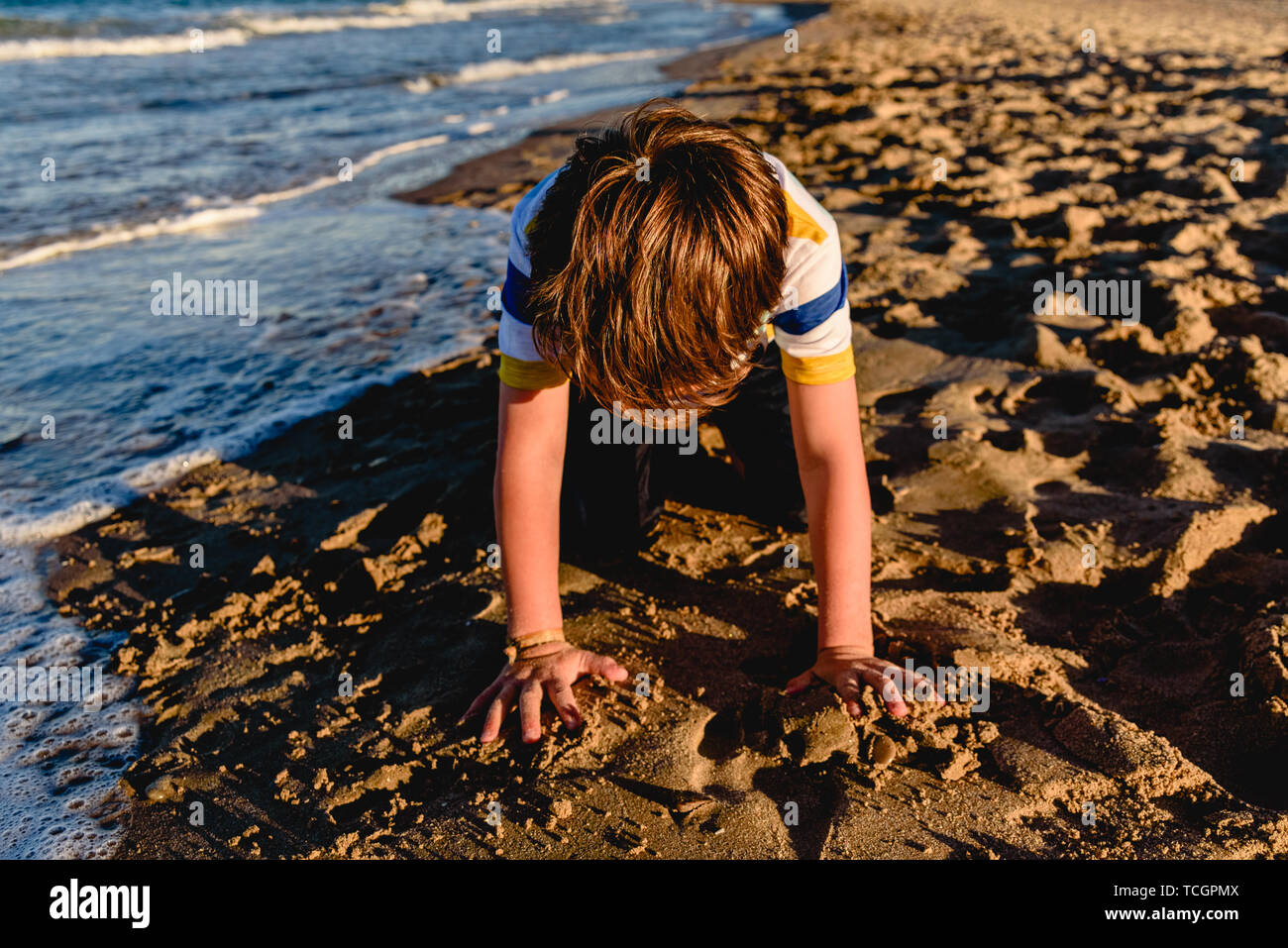 Kneeling In The Sand High Resolution Stock Photography and Images - Alamy