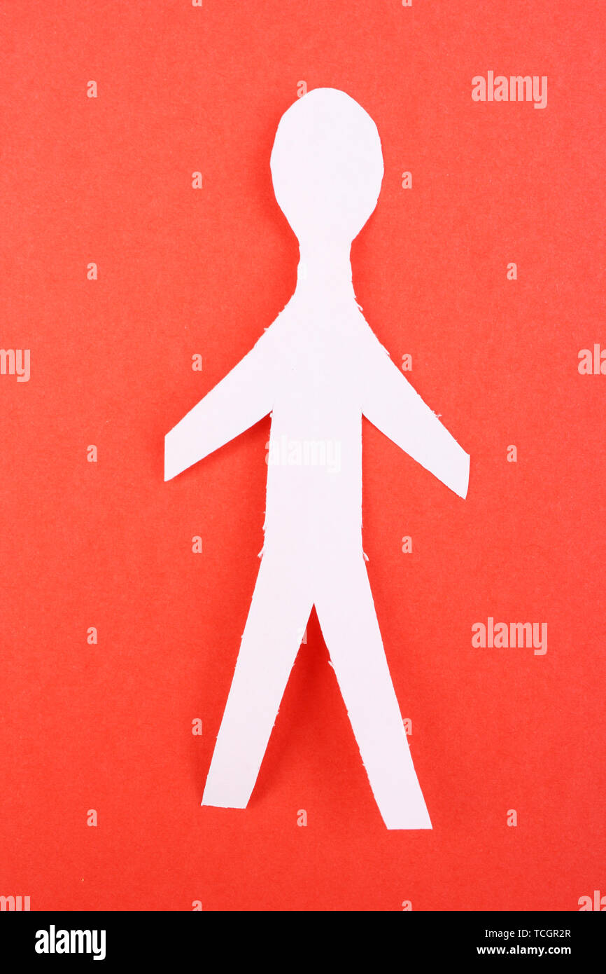 Paper man on red background Stock Photo - Alamy