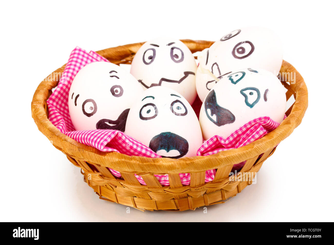 White eggs with funny faces in basket isolated on white Stock Photo - Alamy
