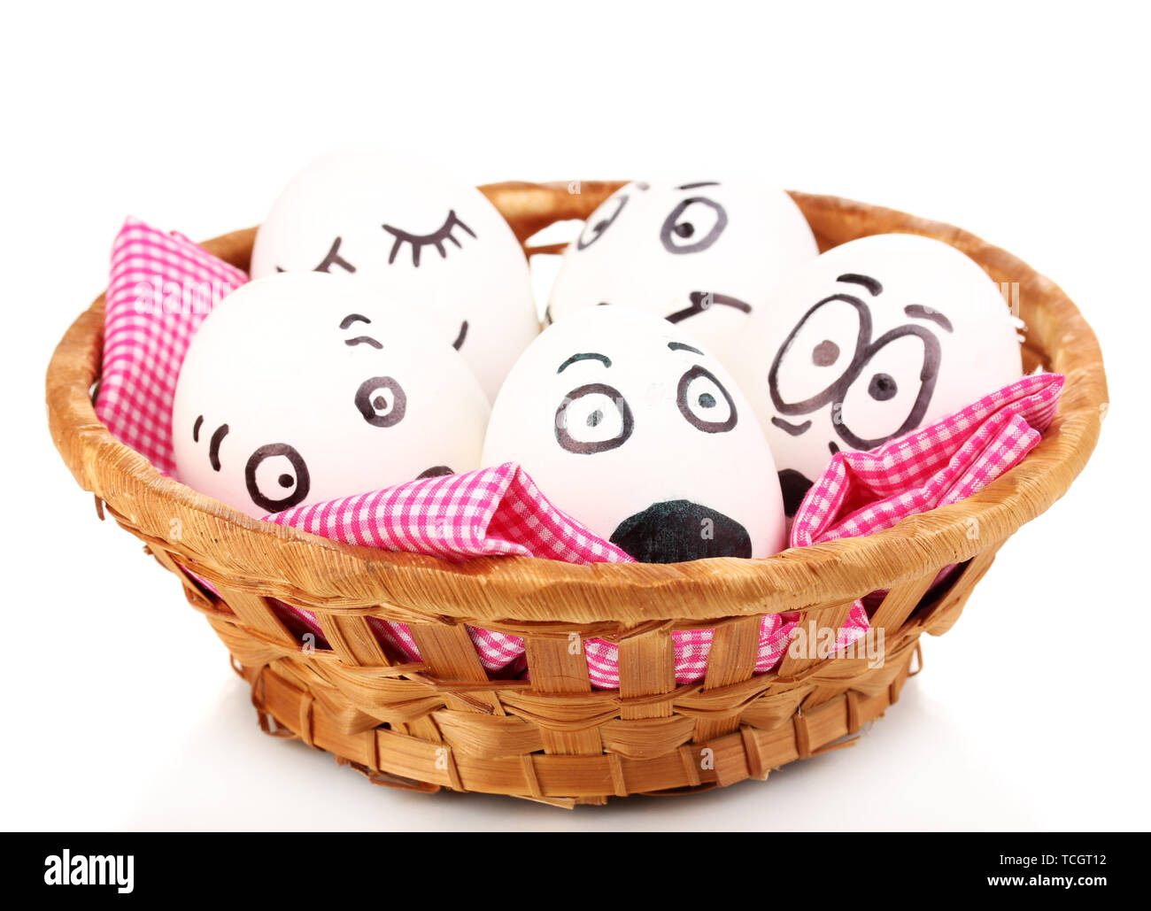 White eggs with funny faces in basket isolated on white Stock Photo - Alamy