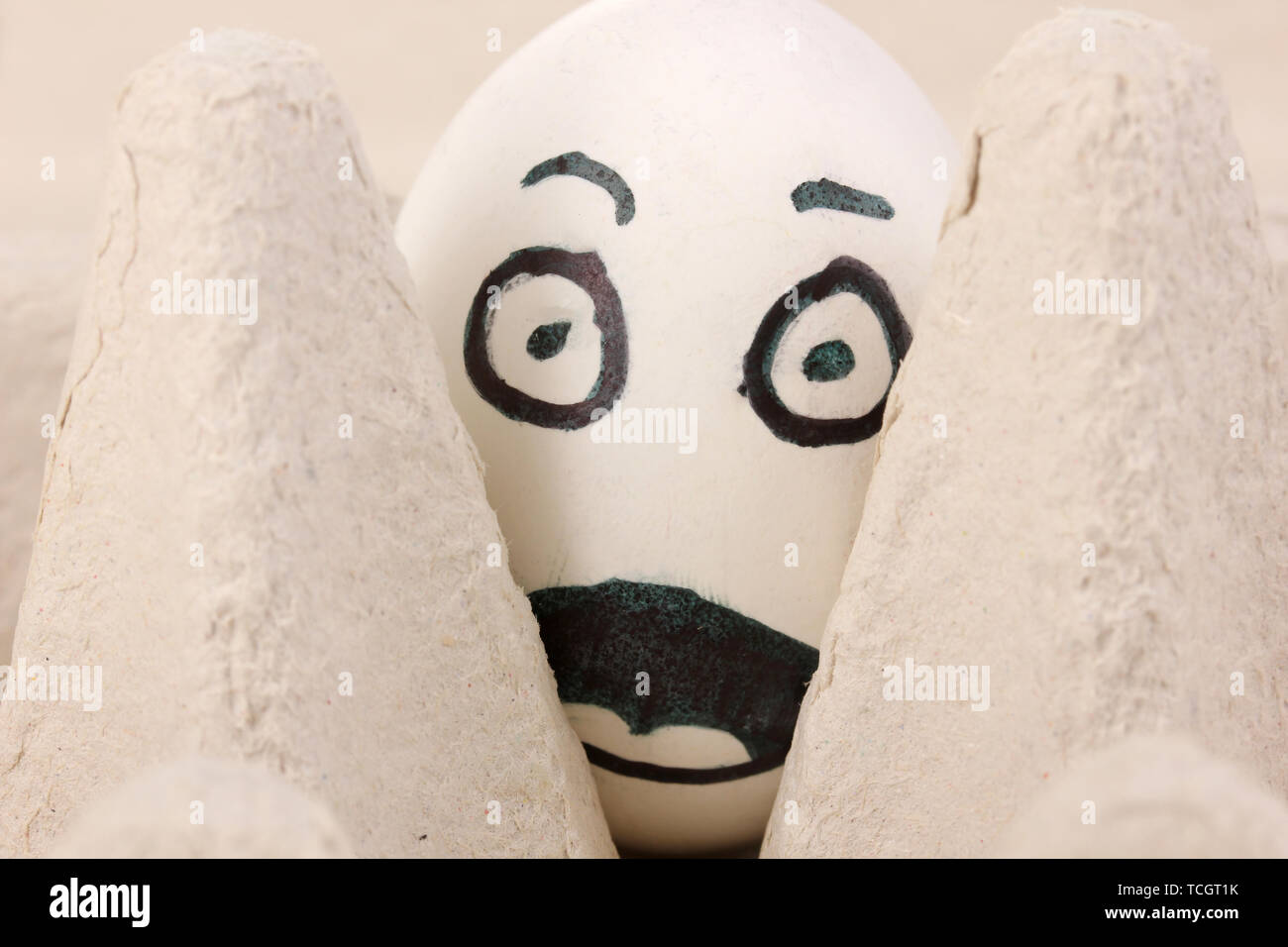 White egg with funny face Stock Photo - Alamy