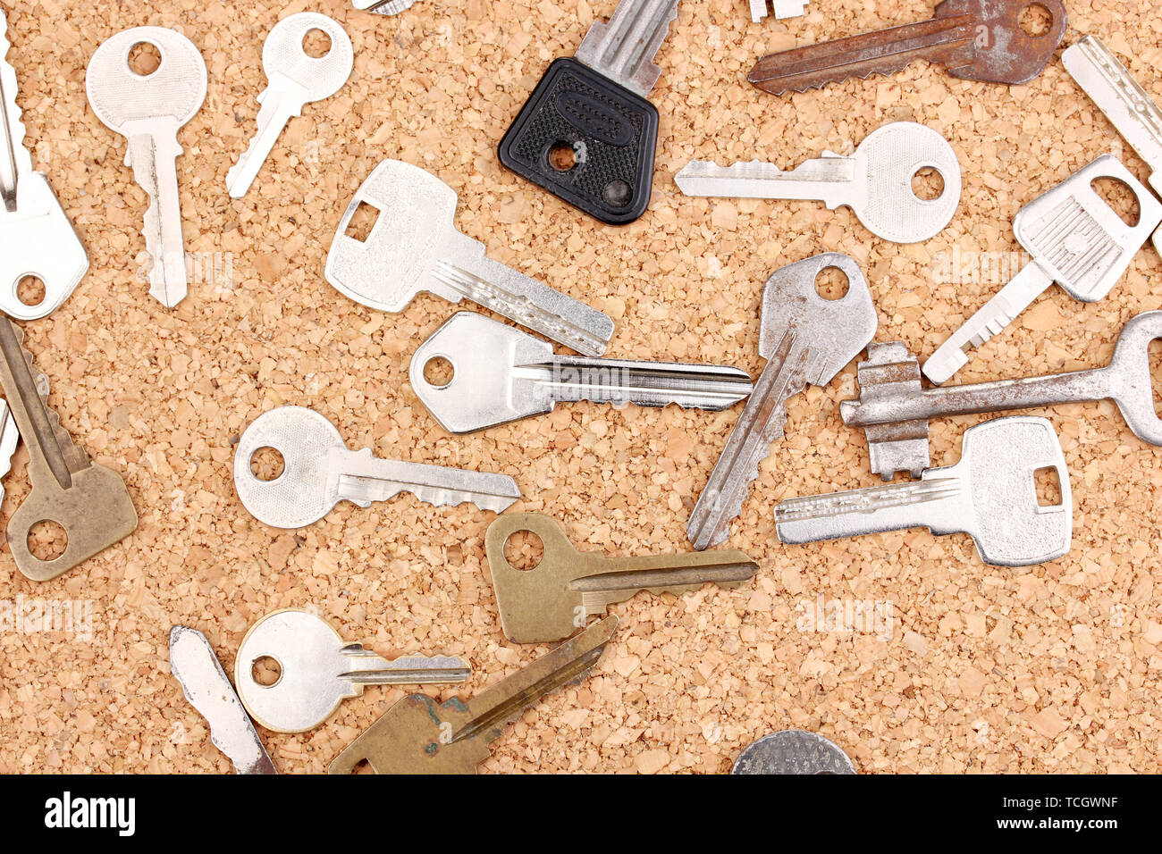 Keys on cork background Stock Photo