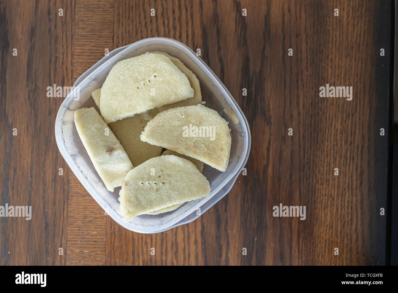 Nigerian boiled yam in plastic container Stock Photo Alamy