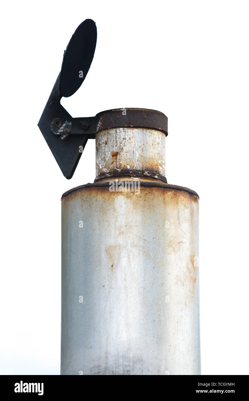 A tractor exhaust pipe with muffler and rain flap and rust Stock Photo