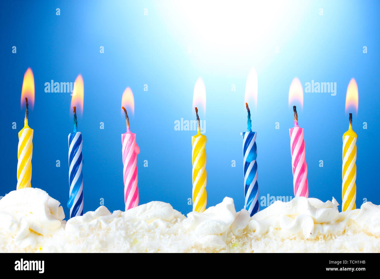 beautiful birthday candles on blue background Stock Photo - Alamy