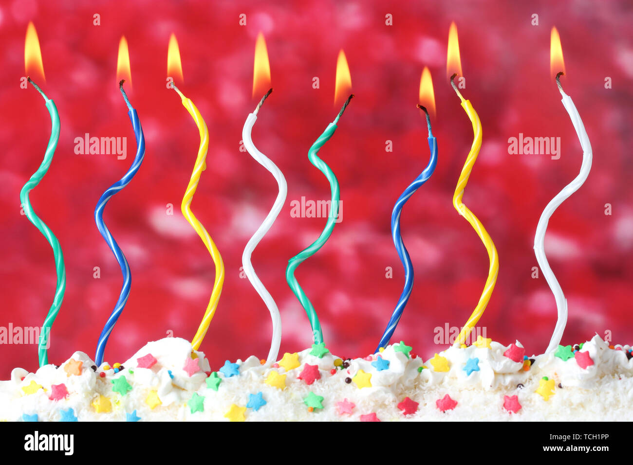 beautiful birthday candles on red background Stock Photo - Alamy