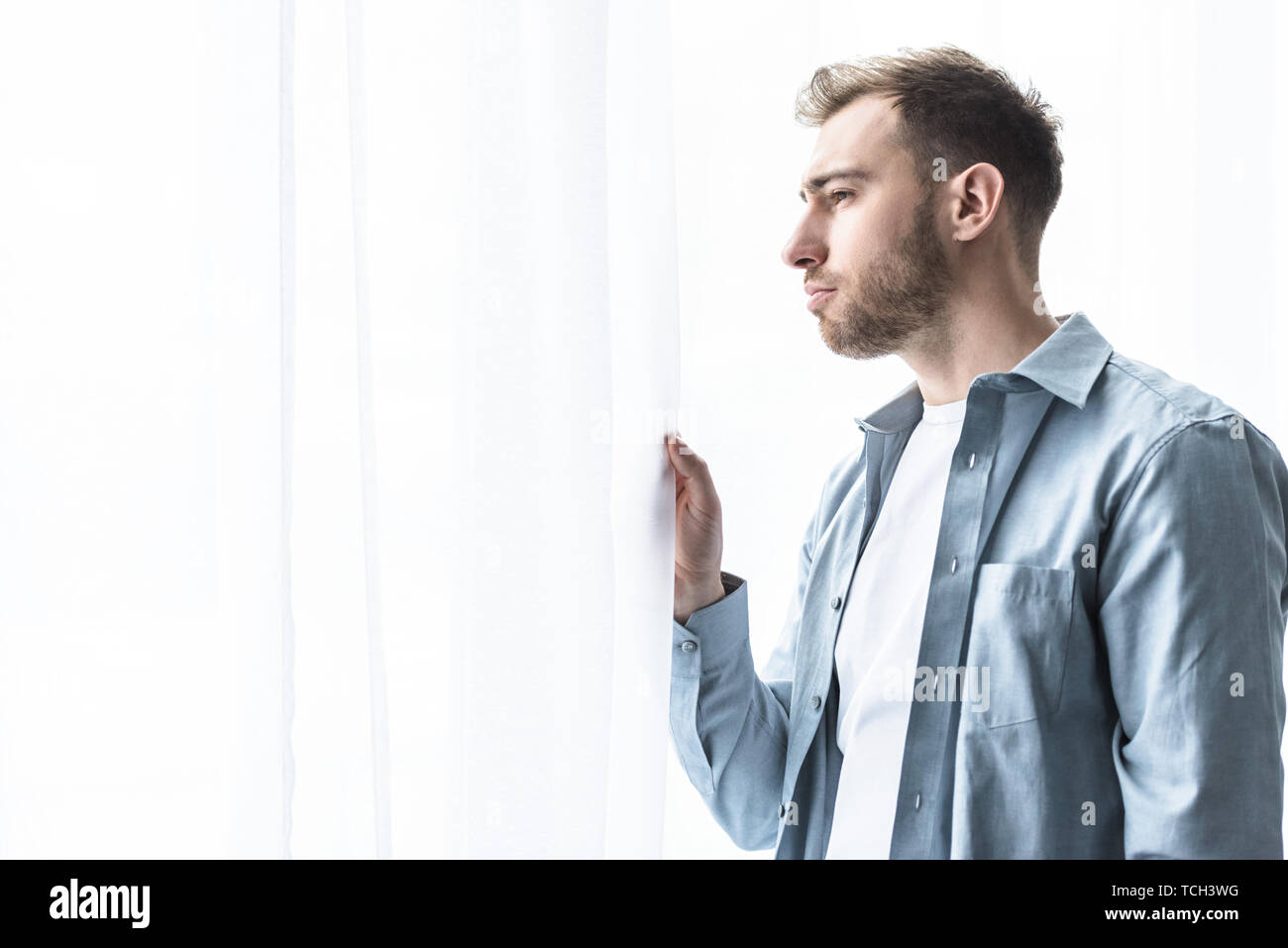 Sad man in blue shirt hi-res stock photography and images - Alamy