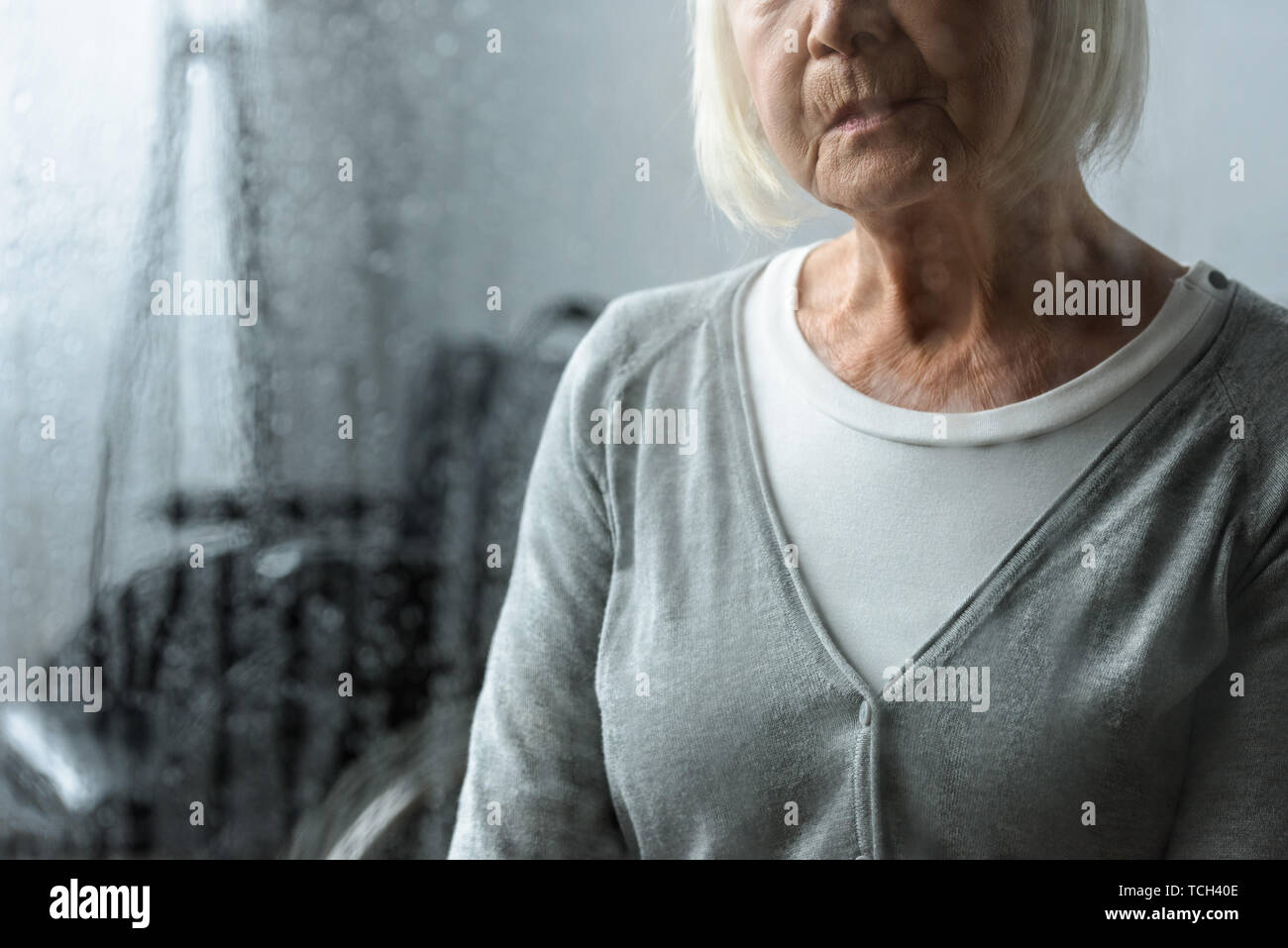 partial view of sad senior woman with grey hair Stock Photo - Alamy