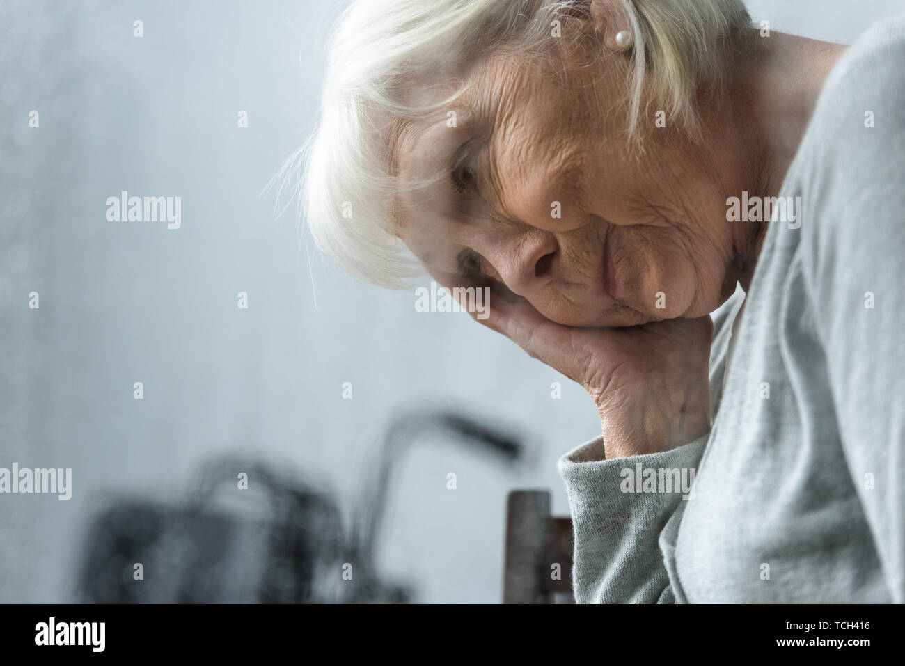 sad senior woman with grey hair looking away Stock Photo - Alamy