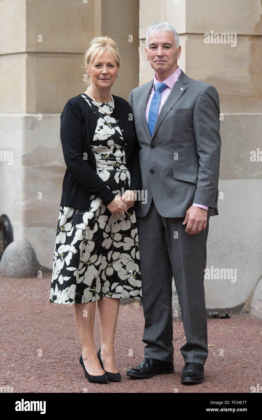 Elizabeth and David Carney at Lancaster House in London, who have been awarded OBEs in the Queen's Birthday Honours List for services to children affected by domestic abuse. Stock Photo