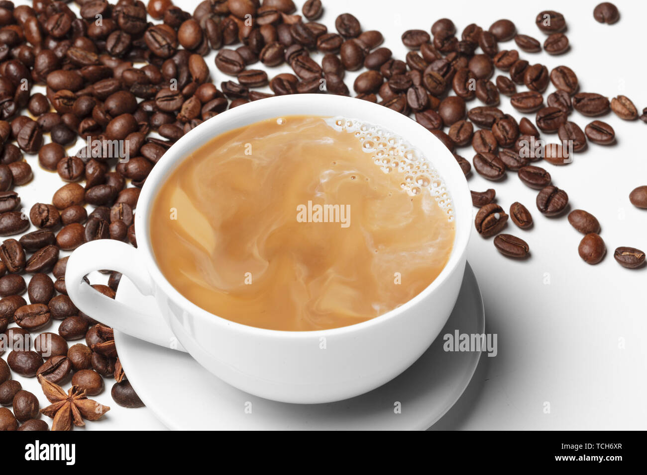 Coffee bean small cup full of coffee bean isolated on white Stock Photo