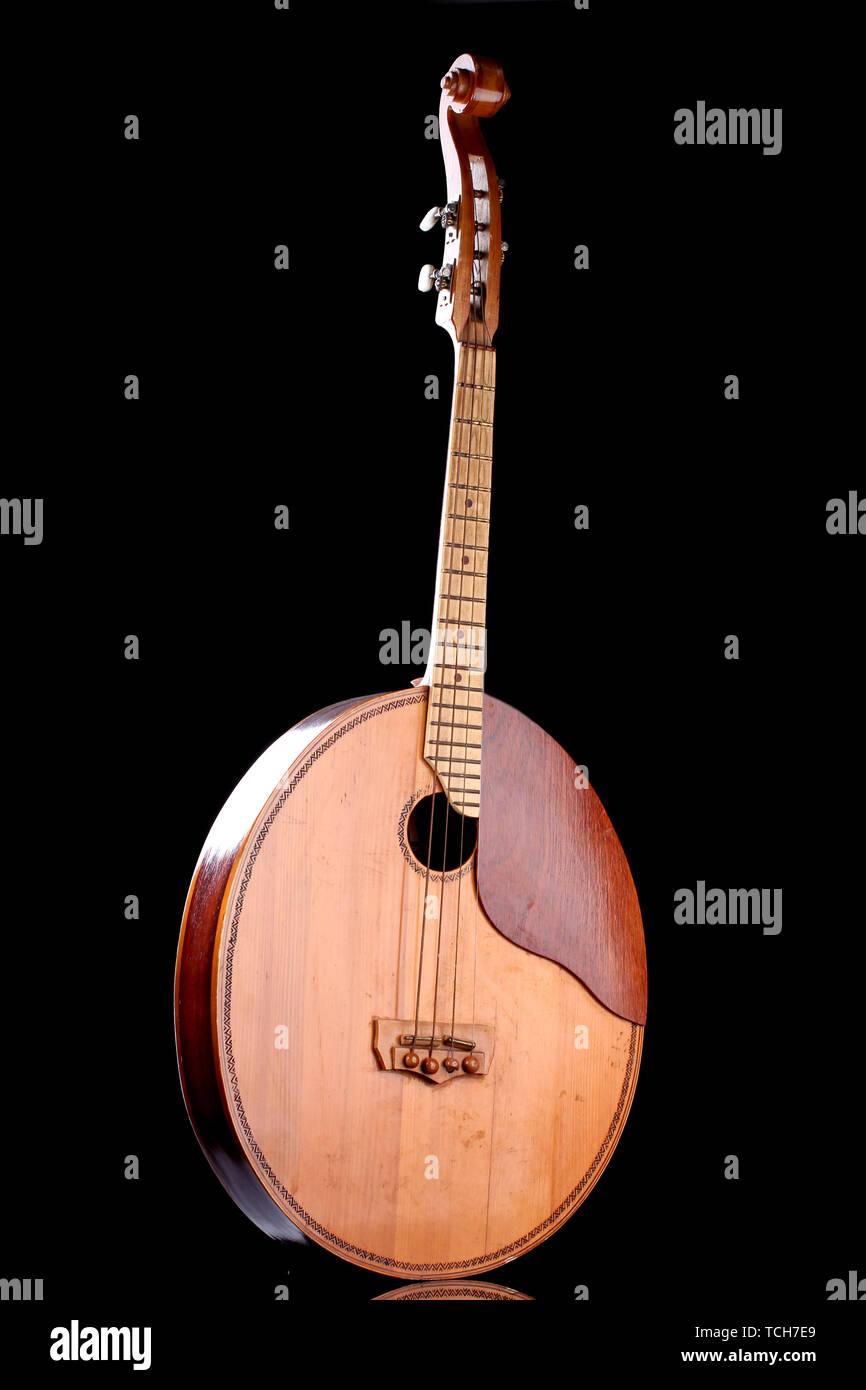 Retro kobza- Ukrainian musical instrument on black background Stock Photo