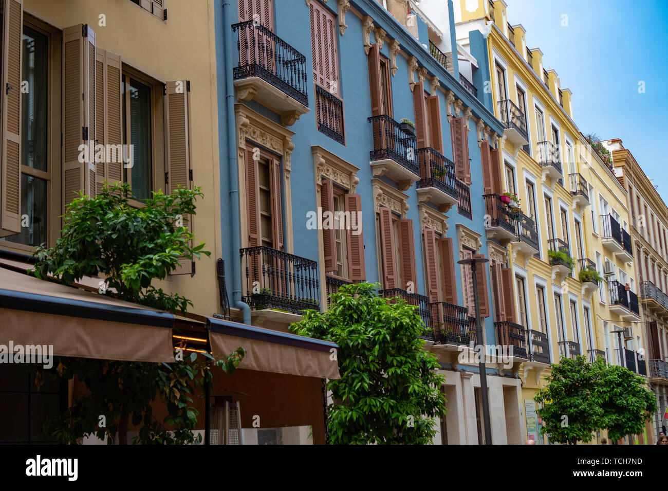 Colorful Decorated exteriours residental buildings in Malaga city, Andalusia, Spain. It's a popular shopping destination for tourists and locals Stock Photo