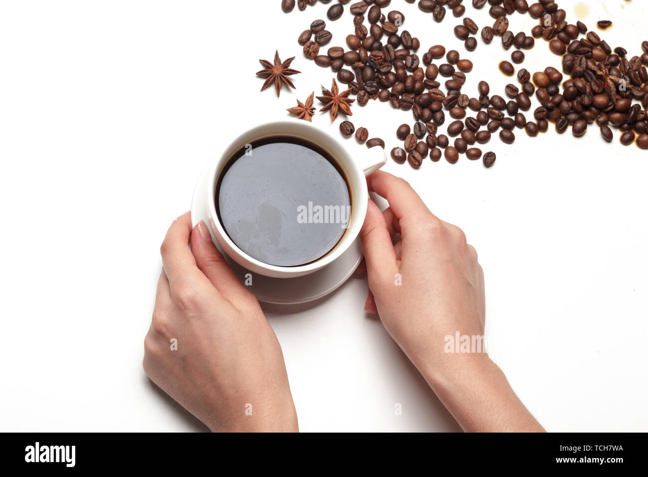 Coffee bean small cup full of coffee bean isolated on white Stock Photo
