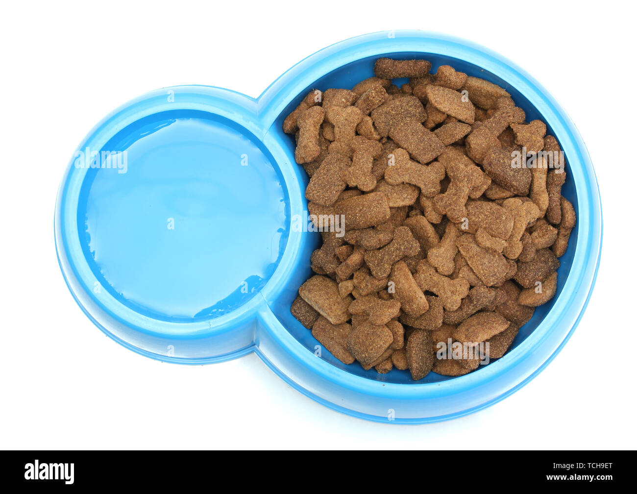 dry dog food and water in blue bowl isolated on white Stock Photo Alamy