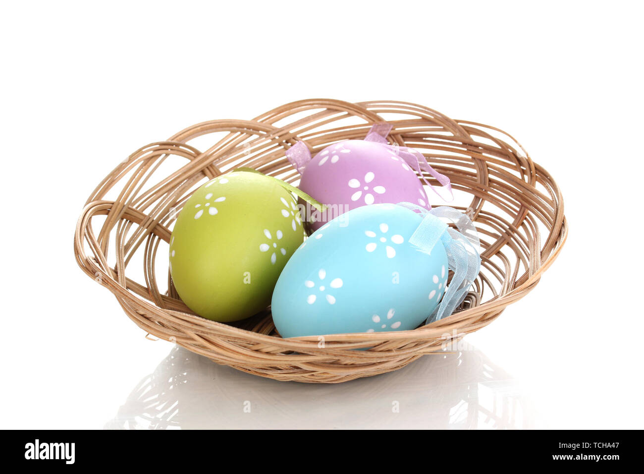 Colorful easter eggs in basket isolated on white Stock Photo - Alamy