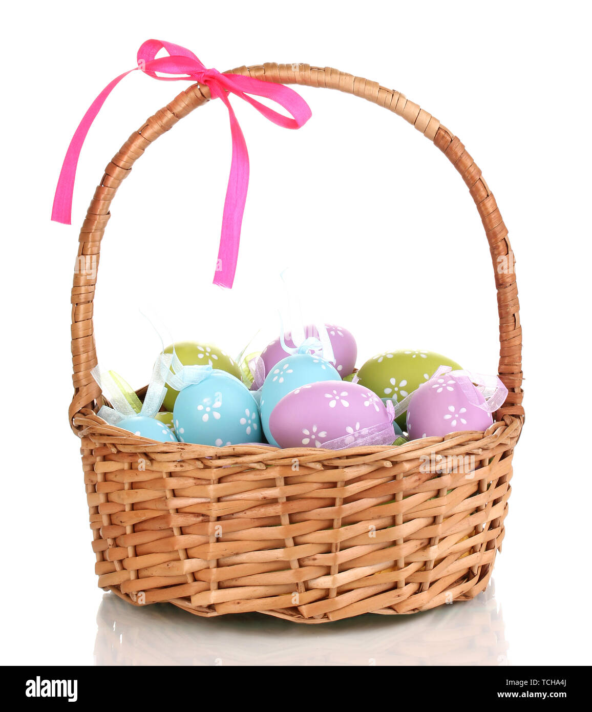Colorful easter eggs in basket isolated on white Stock Photo - Alamy