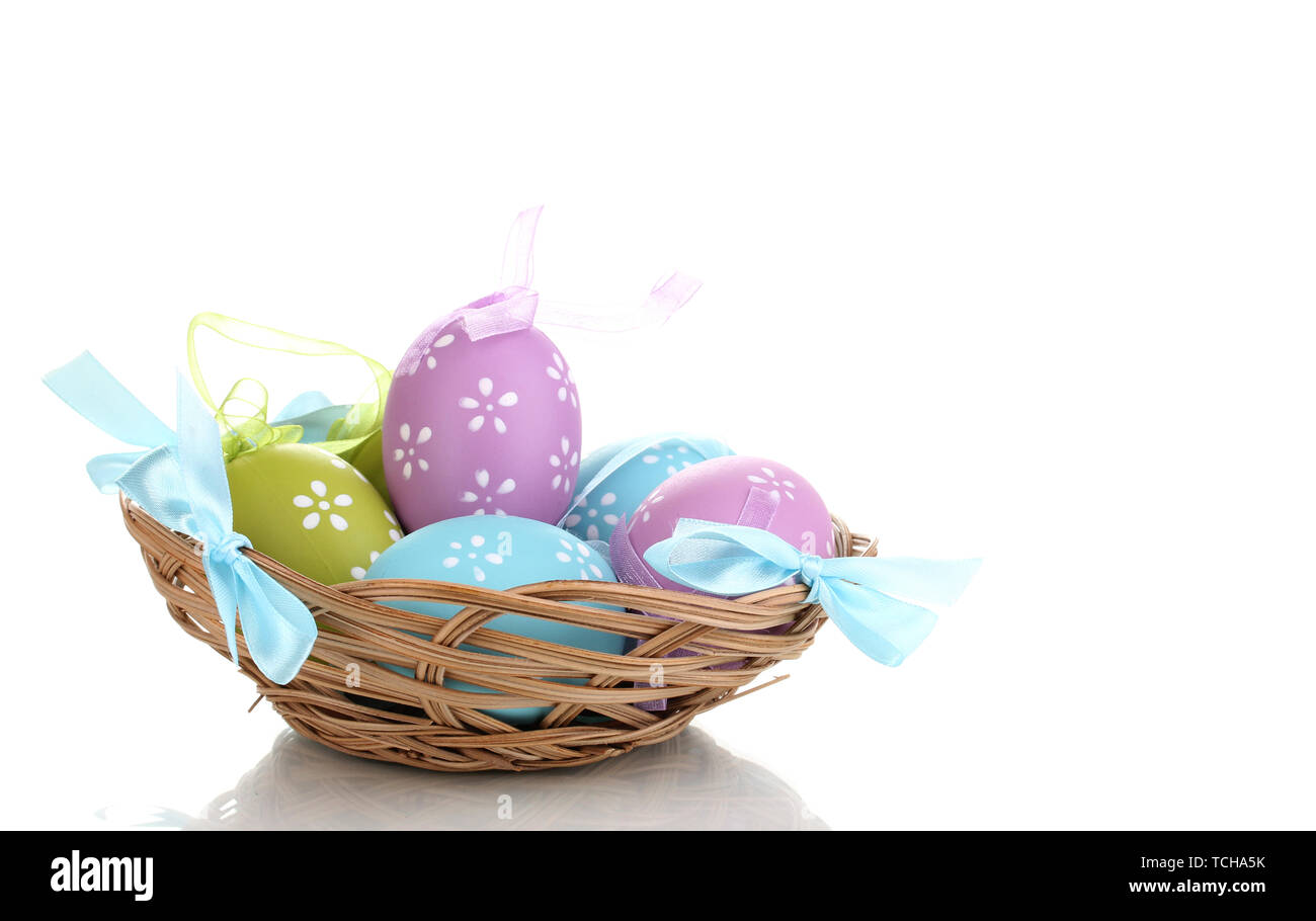 Colorful easter eggs in basket isolated on white Stock Photo - Alamy