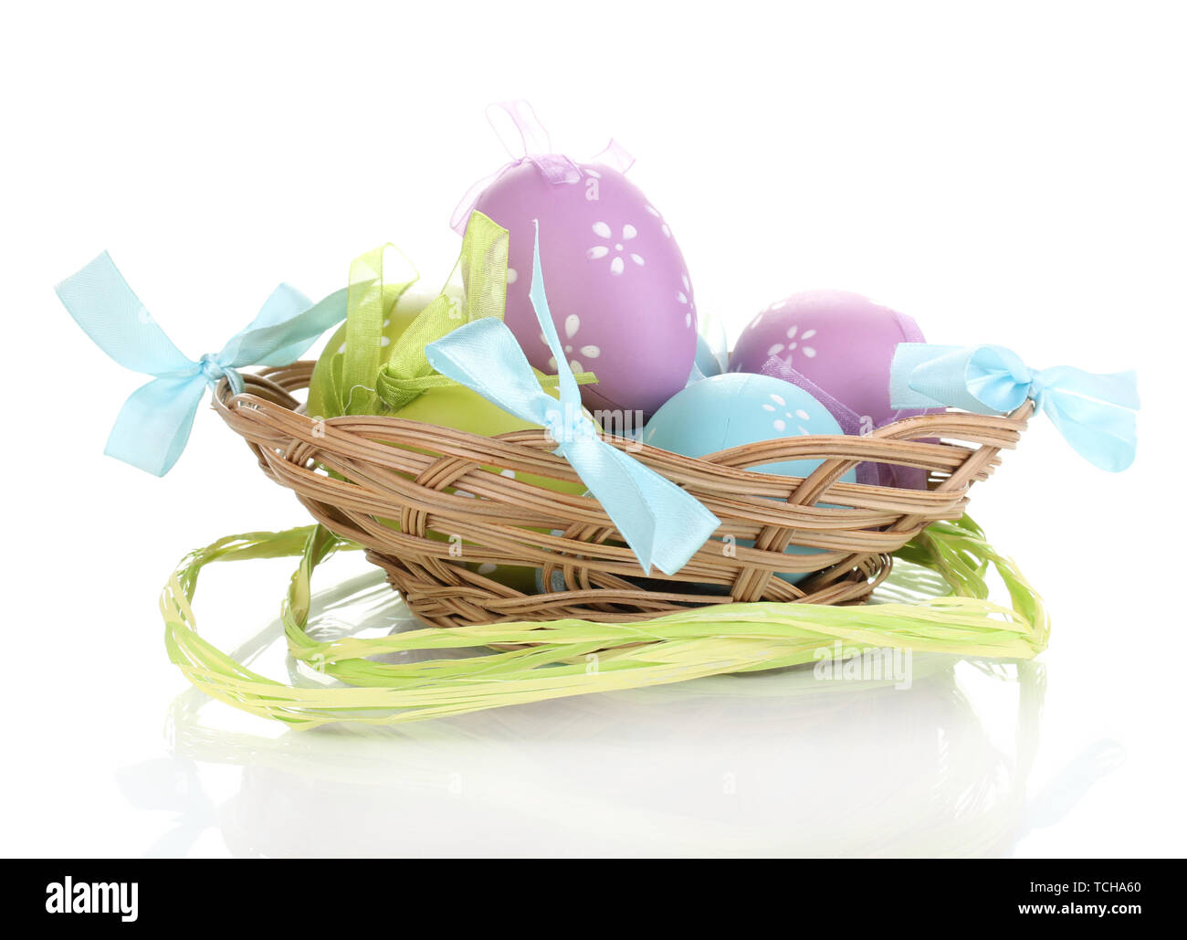 Colorful easter eggs in basket isolated on white Stock Photo - Alamy
