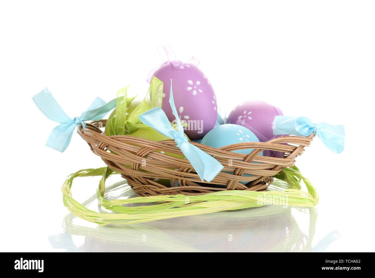 Colorful easter eggs in basket isolated on white Stock Photo - Alamy
