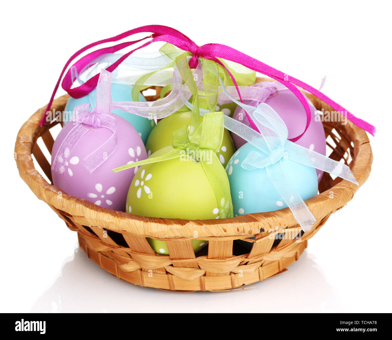 Colorful easter eggs in basket isolated on white Stock Photo - Alamy