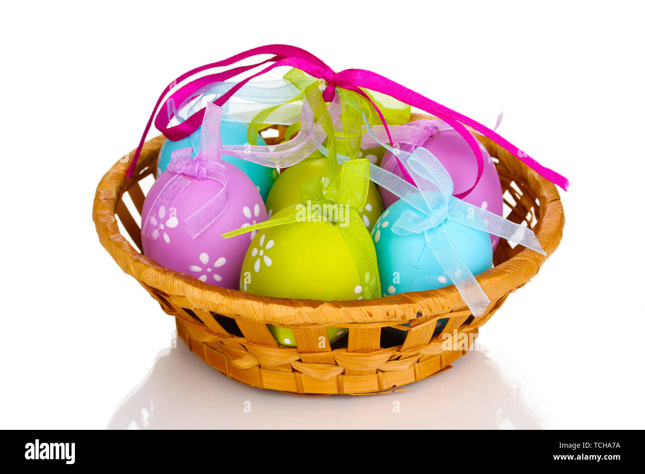 Colorful easter eggs in basket isolated on white Stock Photo - Alamy