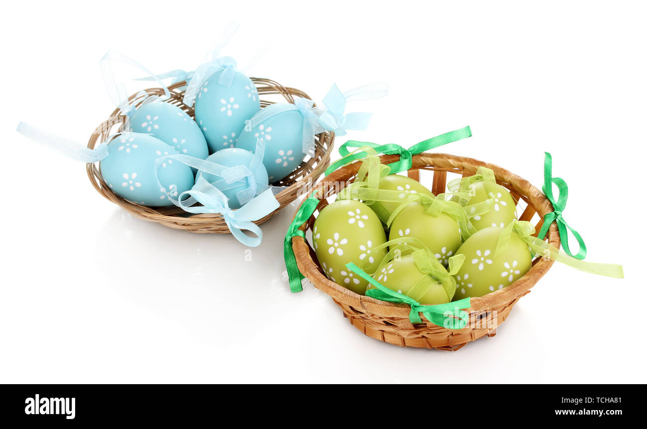 Colorful easter eggs in basket isolated on white Stock Photo - Alamy