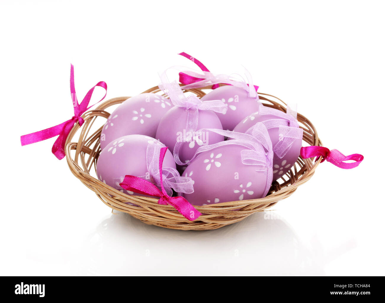 Colorful easter eggs in basket isolated on white Stock Photo - Alamy
