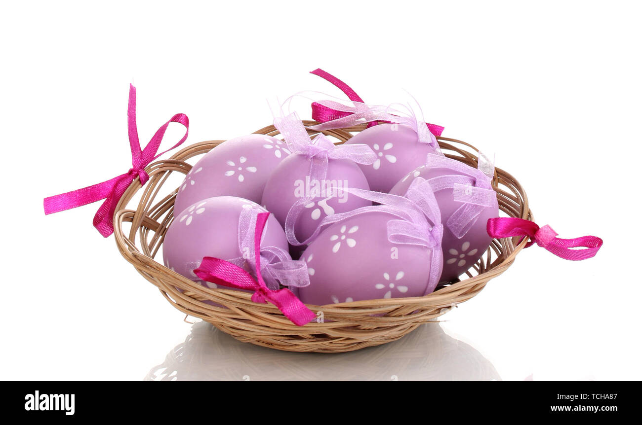 Colorful easter eggs in basket isolated on white Stock Photo - Alamy