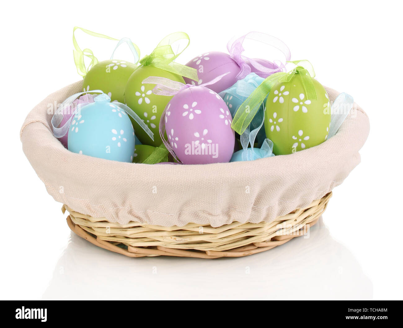 Colorful easter eggs in basket isolated on white Stock Photo - Alamy
