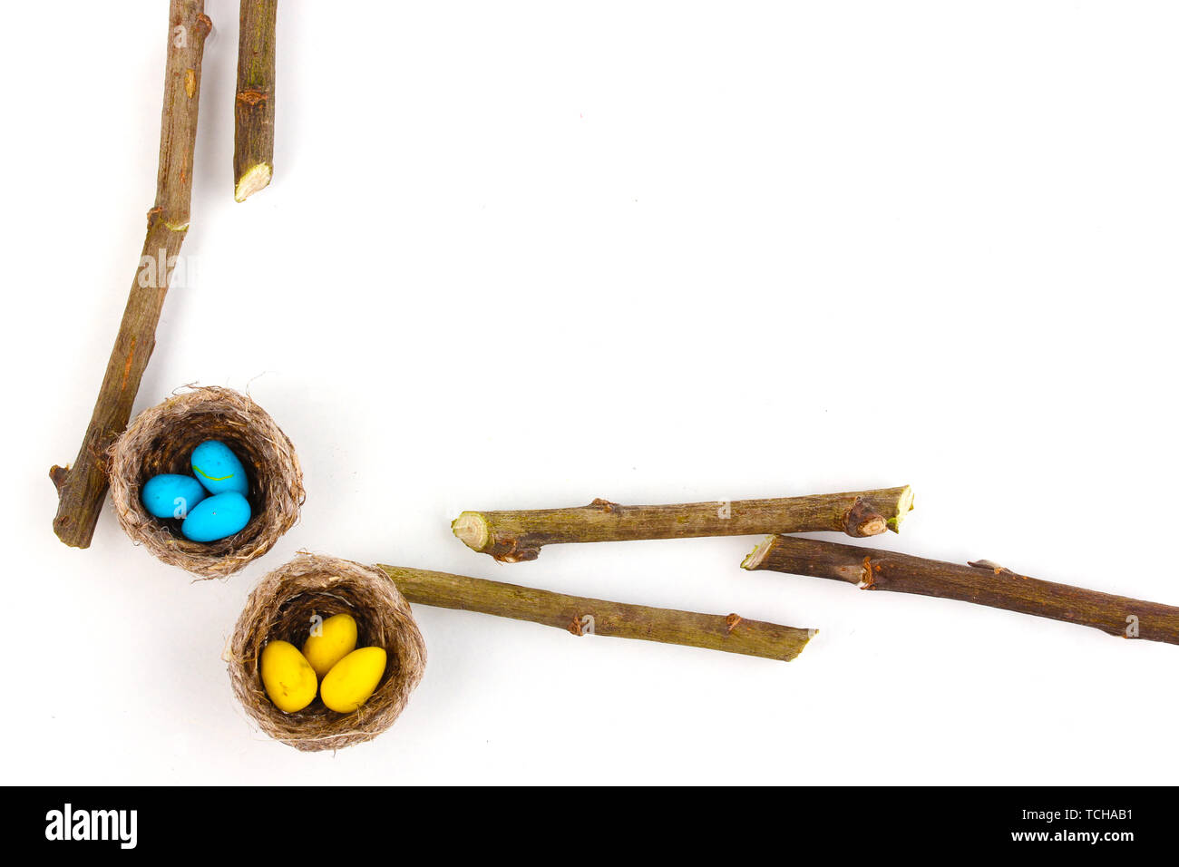 Colorful easter eggs in nests isolated on white Stock Photo - Alamy